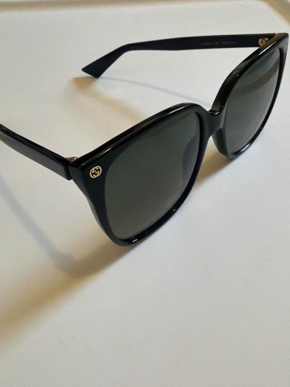 Gucci Black Cat-Eye Sunglasses with Gold Logo Accents